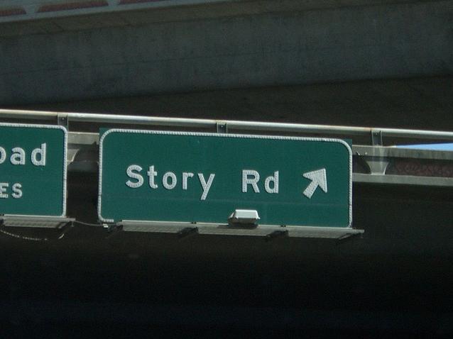 Story Road A road sign that says "story road"